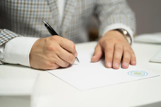man, sign, paper, write, document, contract, signing, agreement, signature, signing document, signing contract, signing paper, sign, contract, contract, contract, contract, contract, signing, agreement, signature, signature. Affiliate contracts for US digital products, the clauses that hold up