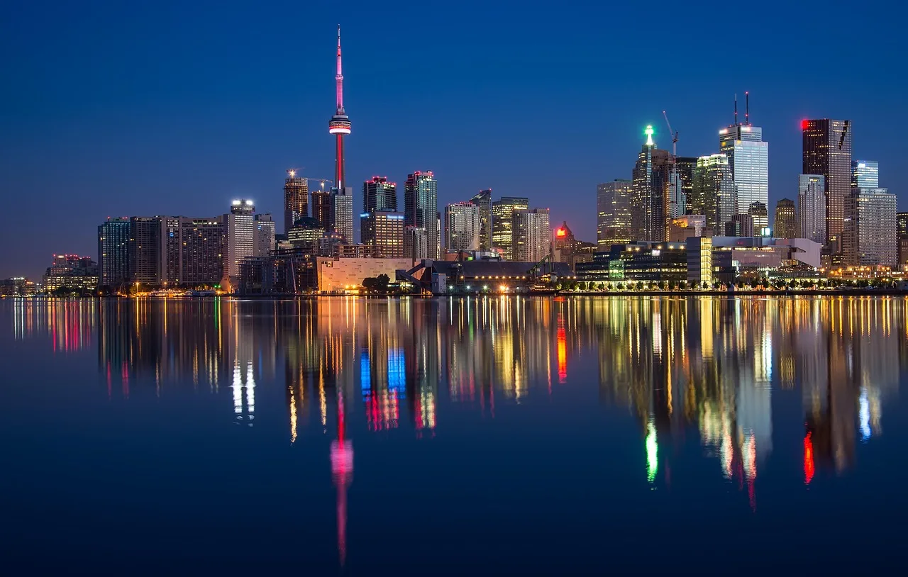 buildings, cn tower, nature, river, waterfront, illuminated, city lights, cityscape, skyline, skyscrapers, architecture, reflection, water reflection, mirroring, canada, night, night photography, ontario, toronto, water, calm waters. How to plan Toronto Montreal Vancouver retention benchmarks